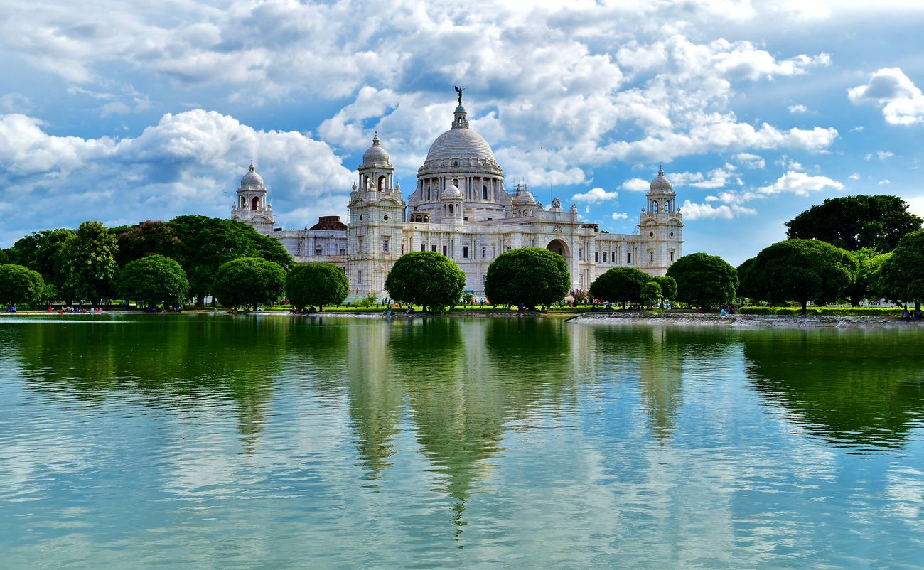 Kolkatas Taj Mahal - Kolkata's Victoria Memorial looks more like a marooned spaceship and less like a relic of the British Raj. To the layman, this marble memorial is a British version of the Taj, and this too had been built in memory of a queen. The flower-speckled parkland, tended lovingly by wizened gardeners, is an invitation to lovers to stroll around arm-in-arm, even as the imposing bronze statue of Queen Victoria seems to look on with a faint air of "not being amused”