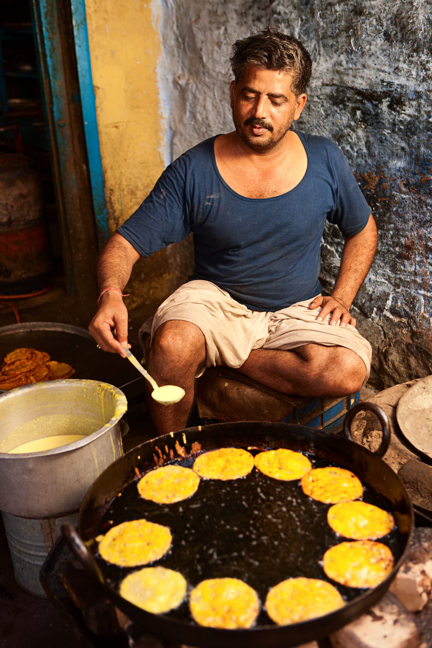 Malpuas are pancakes soaked in sugar syrup and often topped with creamy rabdi. They are especially popular during festivals 