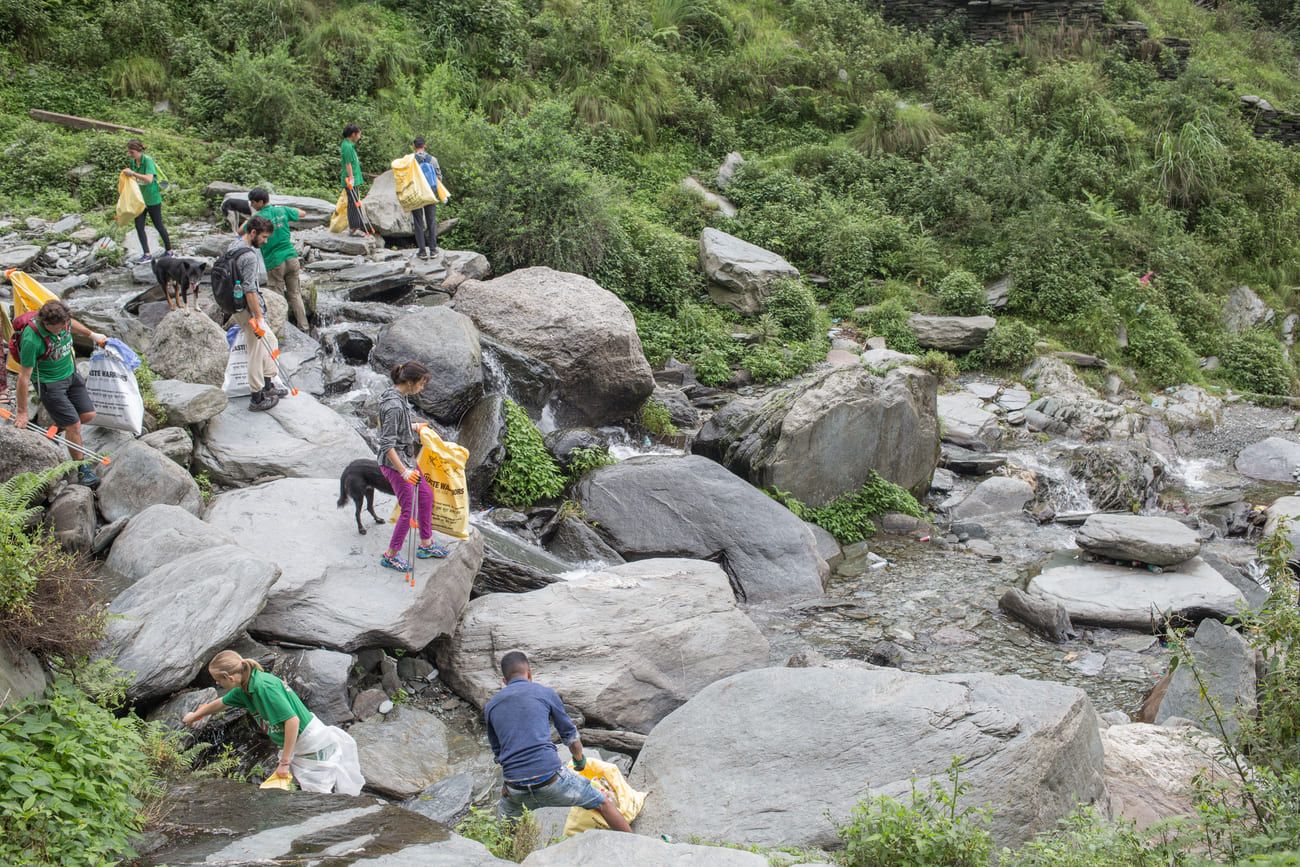 Members of the Waste Warriors NGO clean the area near Bhagsu’s famous waterfall 