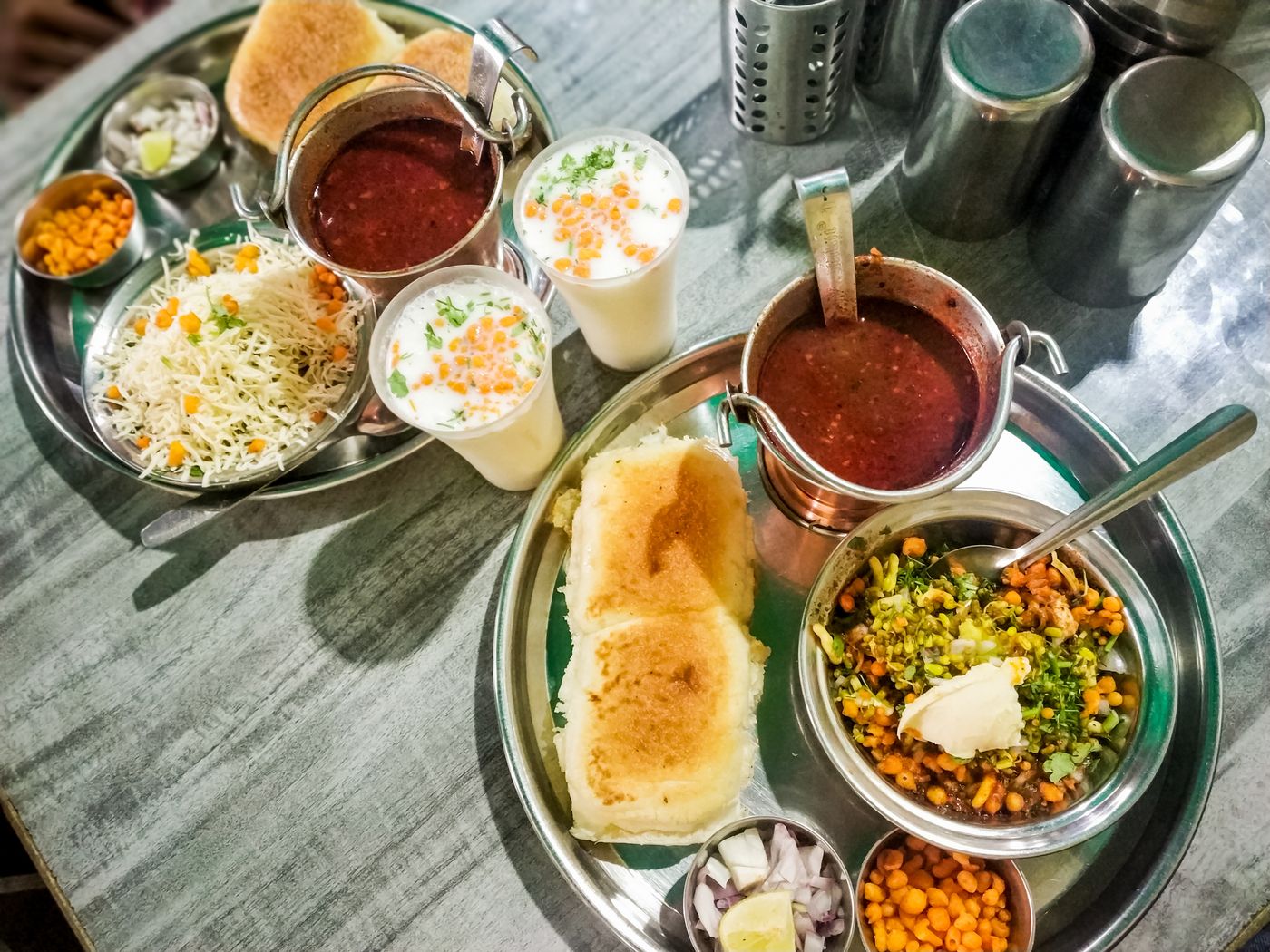 One of Mumbai's most sought after street food dishes is misal pav. It consists of sprout curry (called usal in regional language), with tomatoes and onion. It is finished off with a savory, fried mixture called farsan and lemon juice, and is accompanied by buttermilk and pav bread © Parth Rasse