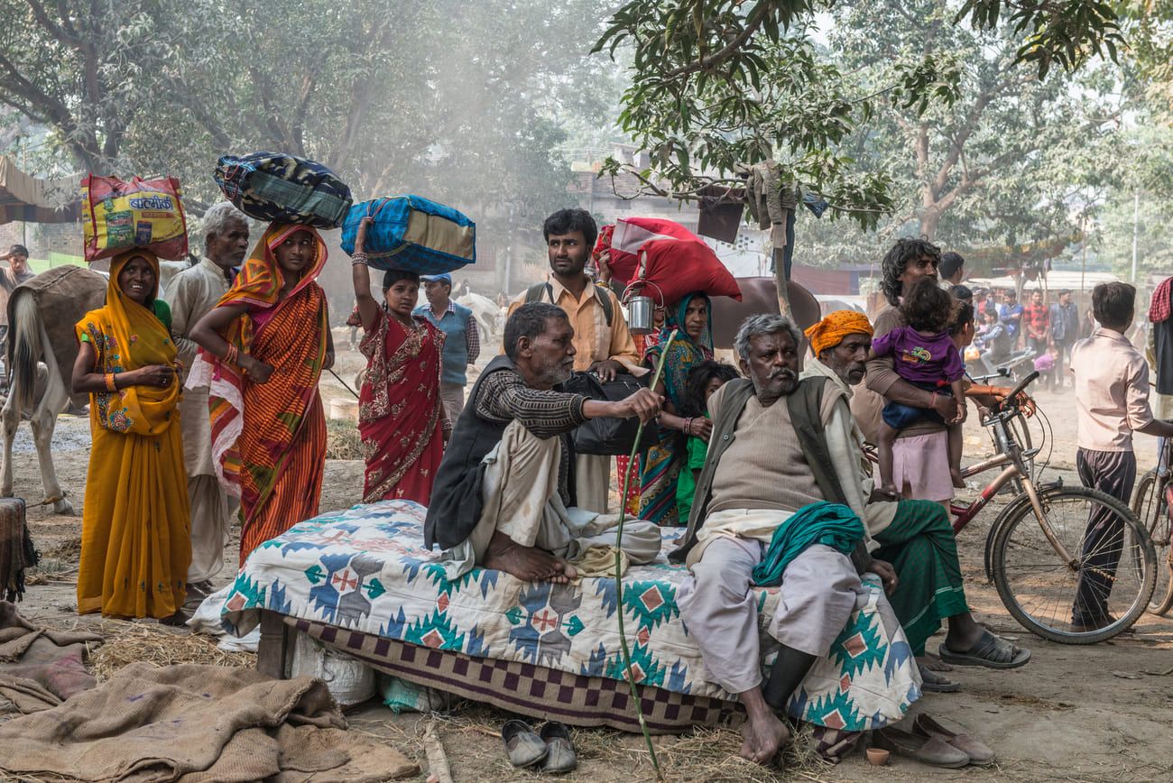 People come from far and wide to attend the largest cattle fair in Asia. This rural family group have just arrived from the countryside 