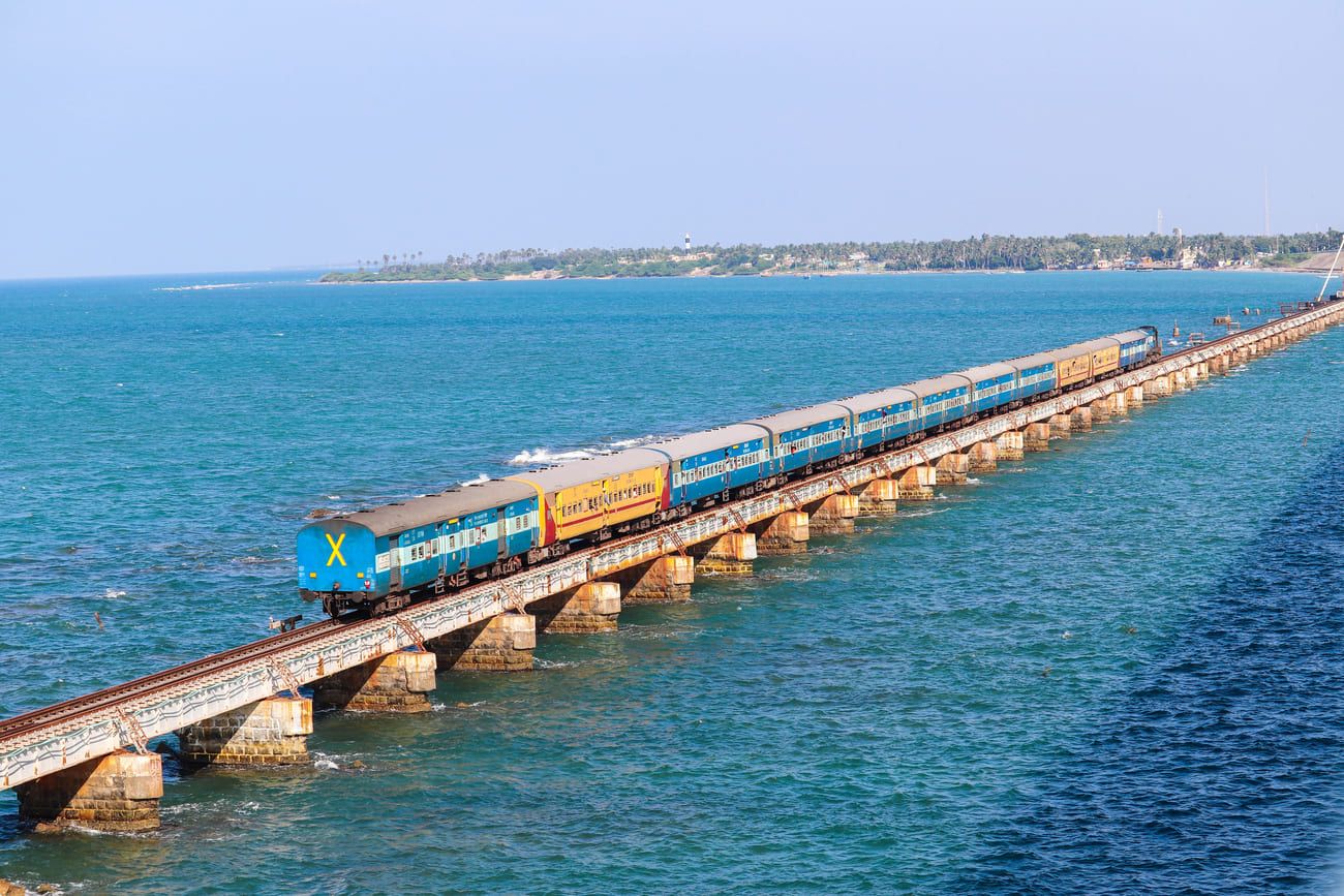 Considered among the holiest of places, Rameshwaram lies on the southern coast, separated by the Channel of Pamban from Sri Lanka. Thousands of tourists take the train across the scenic Pamban sea bridge to the island