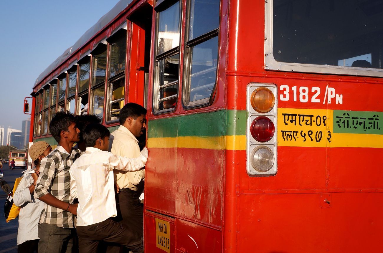 Some passengers in Mumbai entering the BEST bus. The first bus service in India was started in Mumbai on 15th July 1926 between Afgan Church and Crawford Market