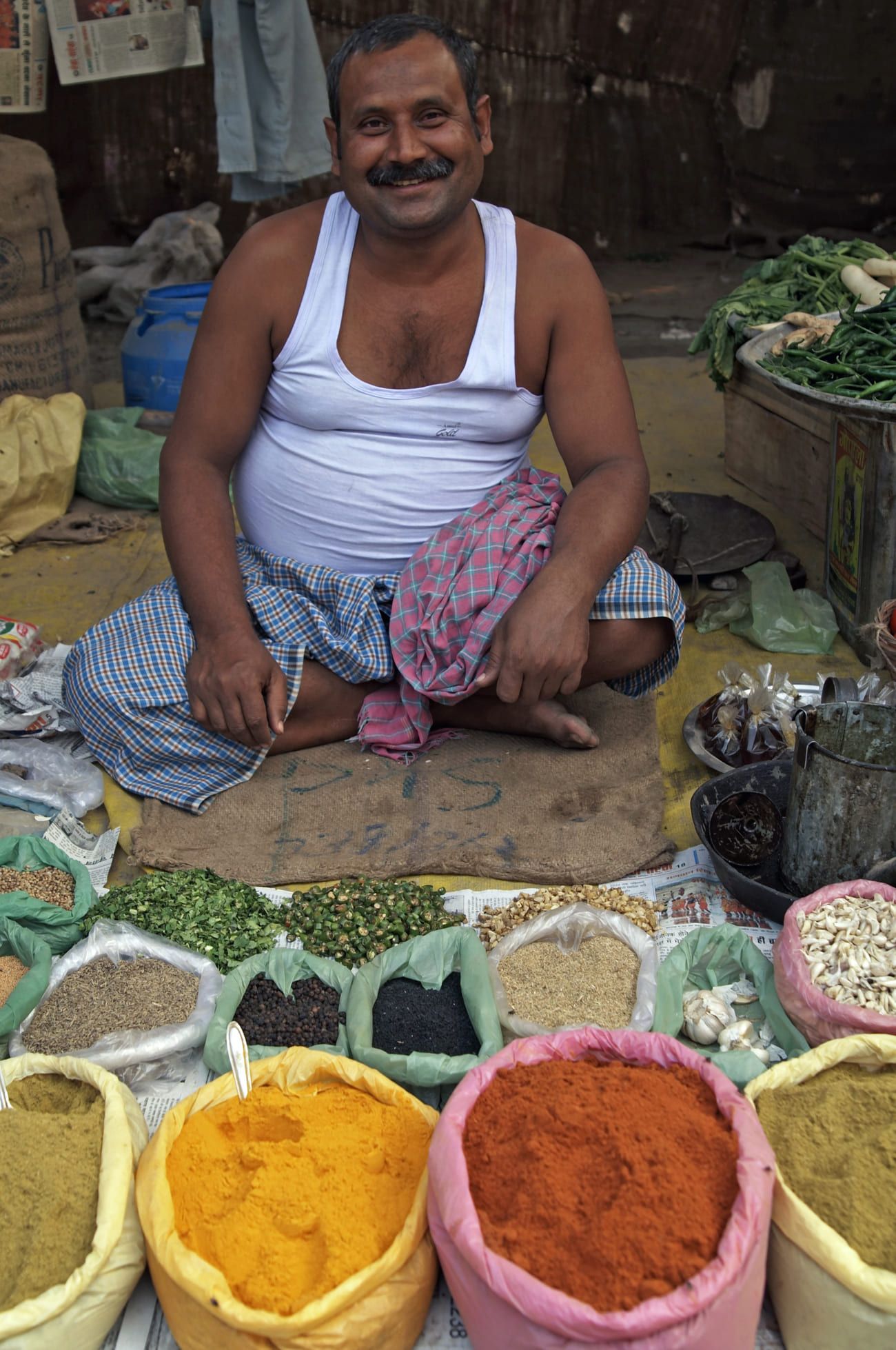 Spice seller happily displaying his fragrant merchandise during the Sonepur Fair, Bihar