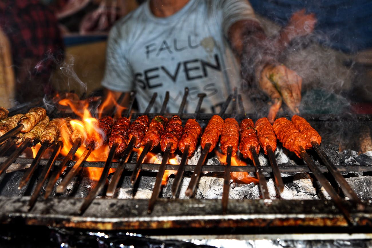 Spicy seekh and tasty camel meat kebabs during an Iftar food festival at the Indian Ramadan market in Shivaji Nagar, Bengaluru
