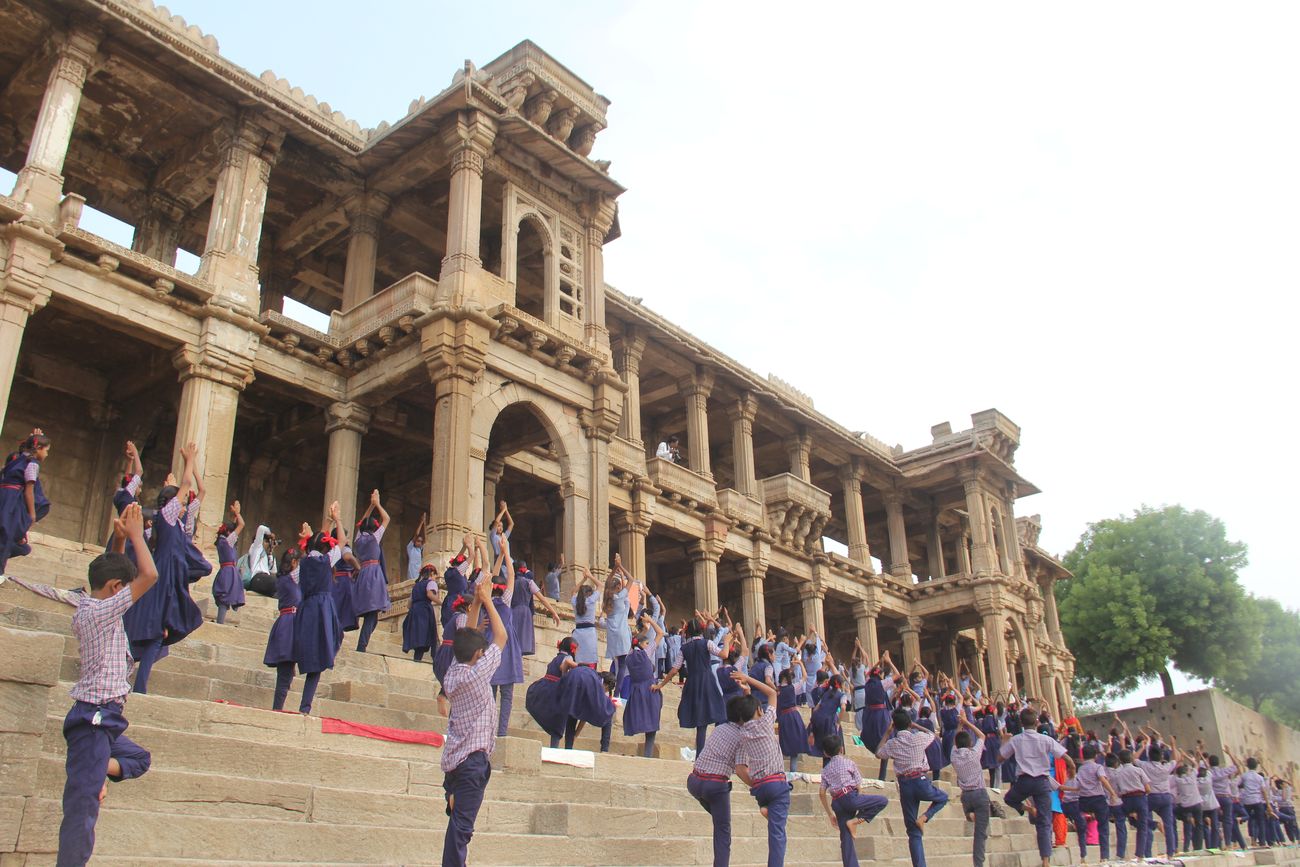 Over two thousand school students perform the Surya Namaskara, salutation to the sun, on the International Yoga Day at Navi Fatehwadi Village in Ahmedabad, Gujarat. 