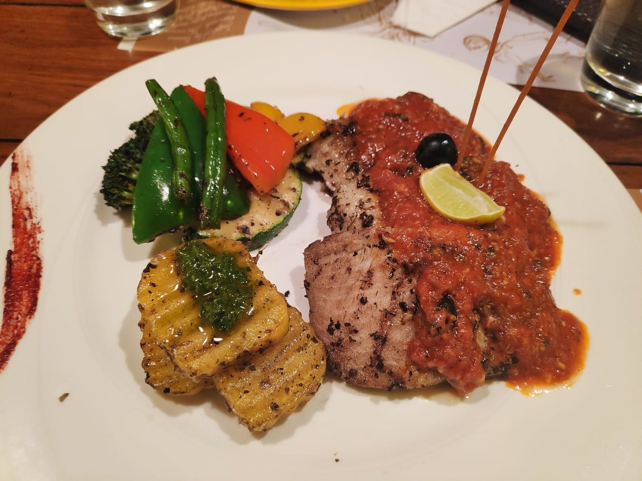 Tasty grilled fish with a peri-peri sauce and vegetables at the Tonino Restaurant, Connaught Place, New Delhi