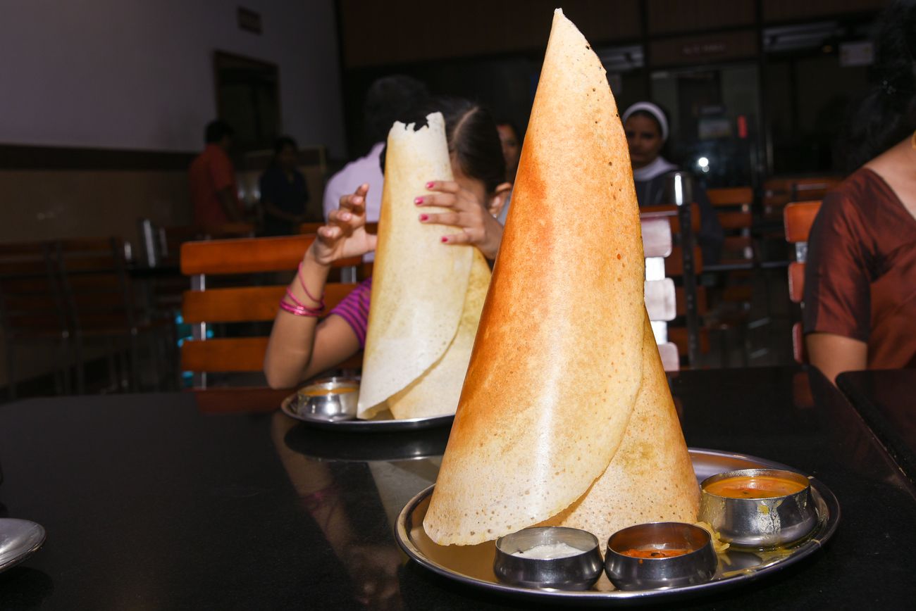 The popular breakfast dish, masala dosa, seen from a different angle. It is served with chutneys, coconut and sambhar curry