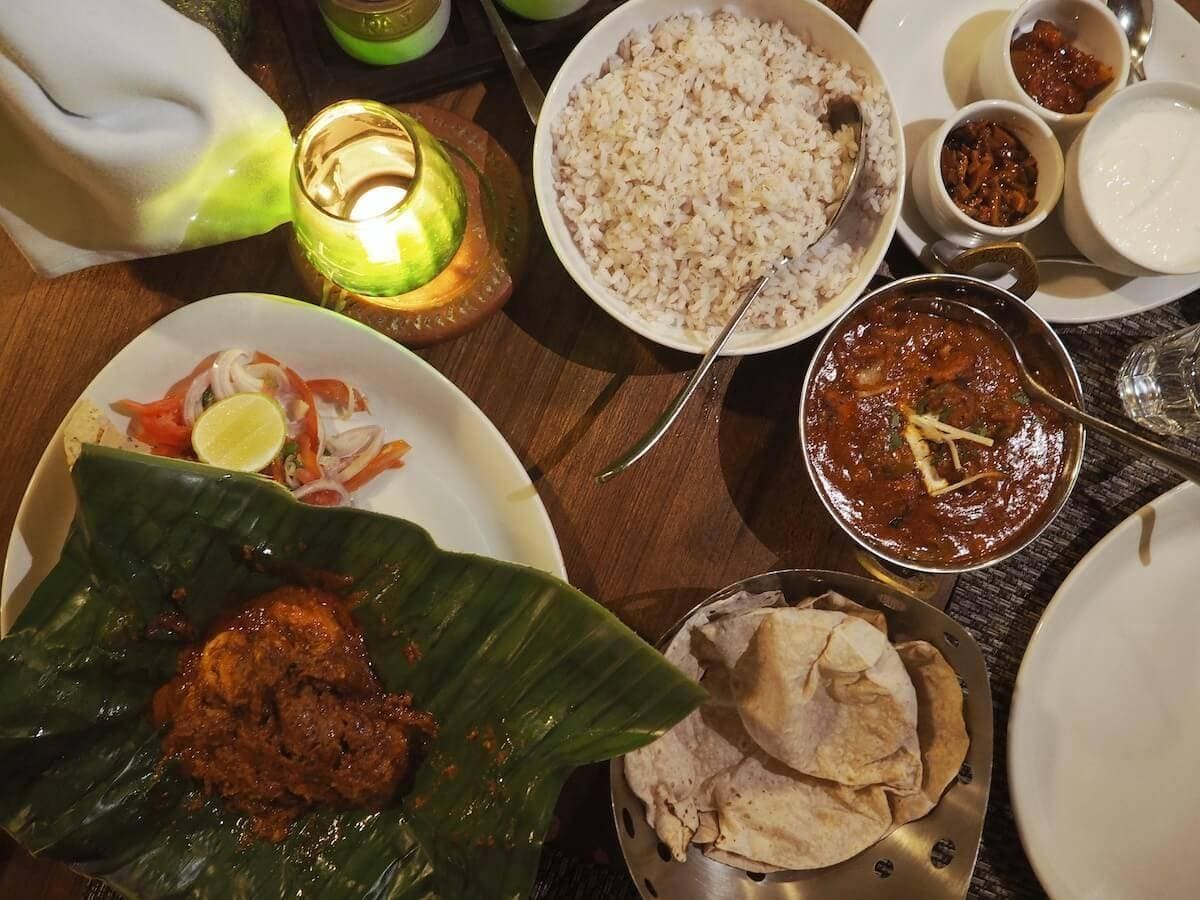 The restaurant with its welcoming ambience serves exquisite Kerala dishes. A favorite is the delicious Prawn Kizhu mixed with onions, tomatoes and spices, wrapped in banana leaves and then grilled on charcoal, and a very tasty Mutton Pepper Roast served with heaps of traditional rice and hot wheat Chapatis (roti).