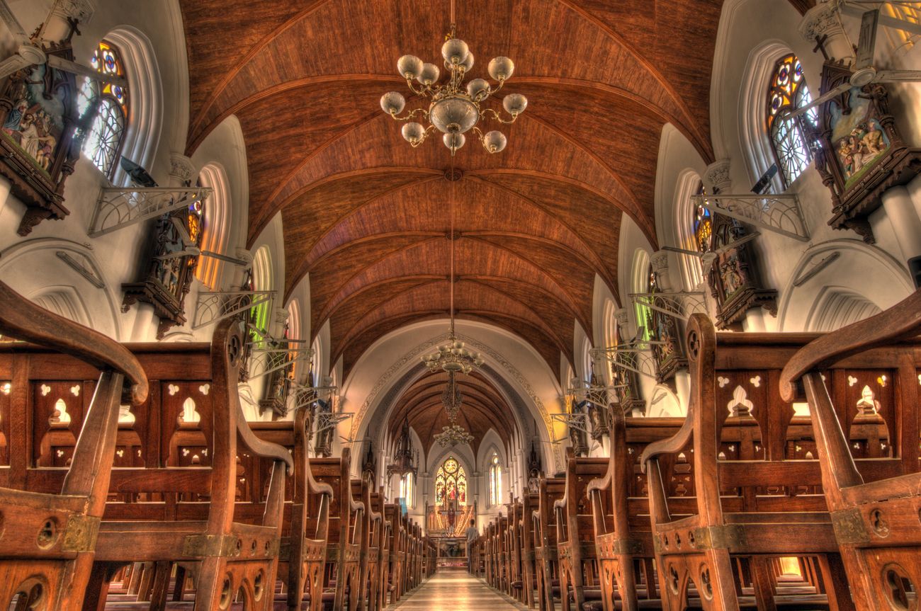 The stunning interior of Santhome Basilica, Chennai, with its intricate woodwork and stained glass windows