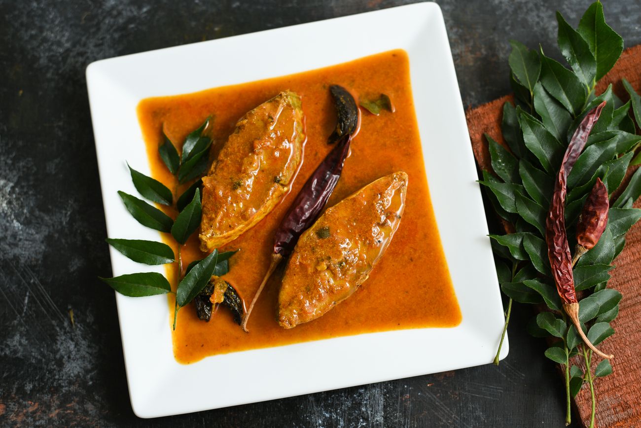 The traditional Bengali Rohu or King fish curry which is made with coconut milk, gambooge, and turmeric, and is very popular across Bengal 
