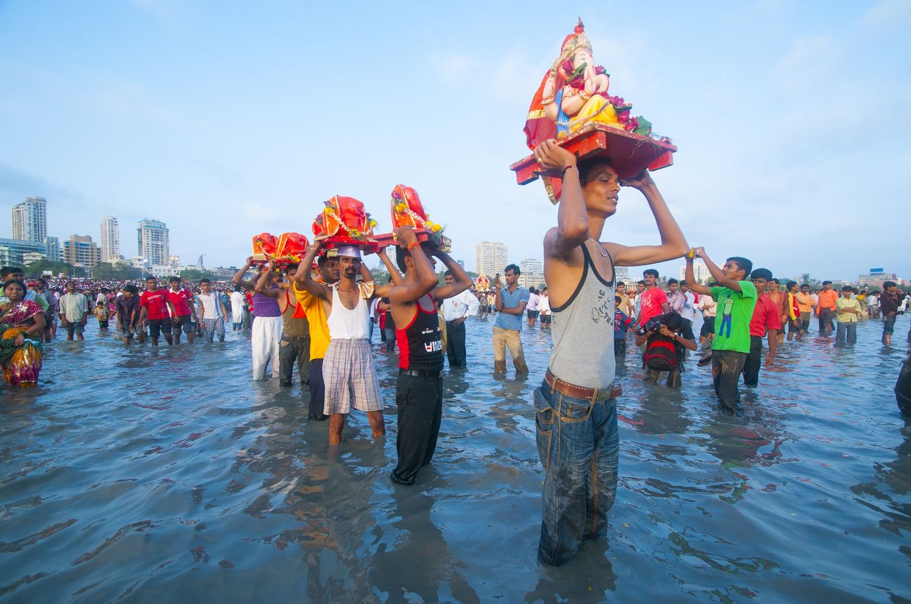 This picture was clicked on Visarjan (last day) at Chaupati beach, Mumbai where devotees bid adieu to Bappa by immersing the statue into the Arabian sea