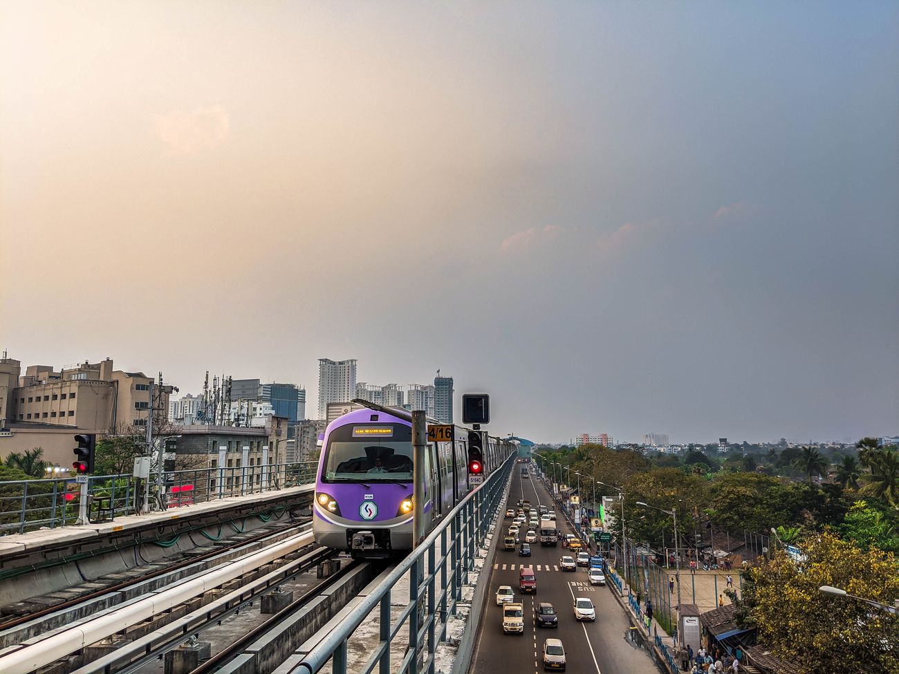 Traffic drives parallel to the overhead East-West metro rail route in Kolkata, West BengaLL