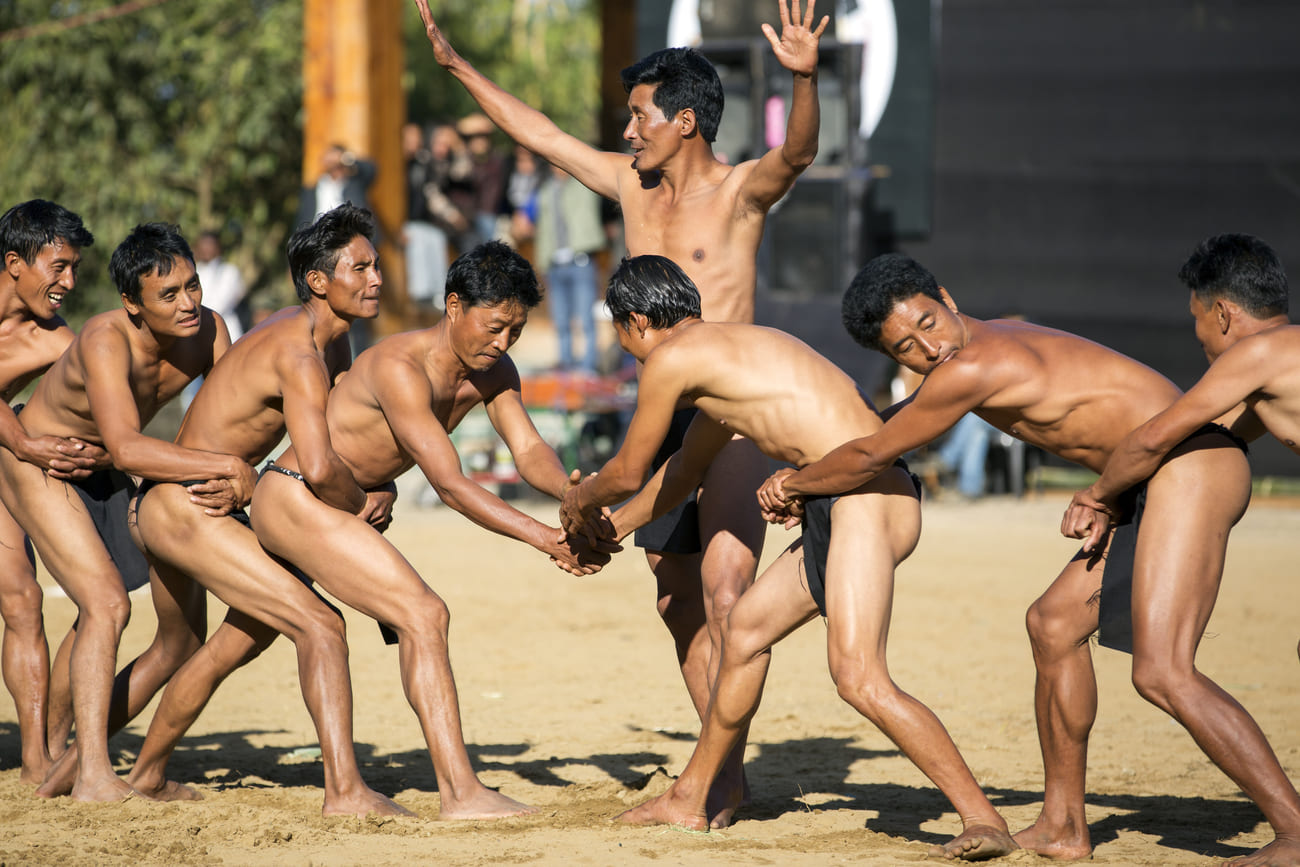 Tribesmen getting ready for a competition of strength, one of the many activities that make up the Hornbill Festival