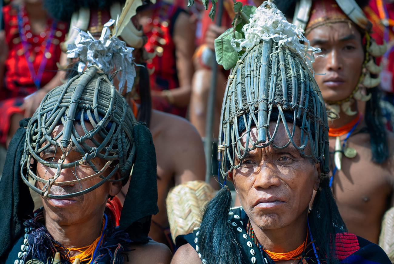 Two men of the Khiamniungan Naga tribe proudly display their interesting headgear. The festival consists of indigenous games, dances, traditional food, sport events and folk music