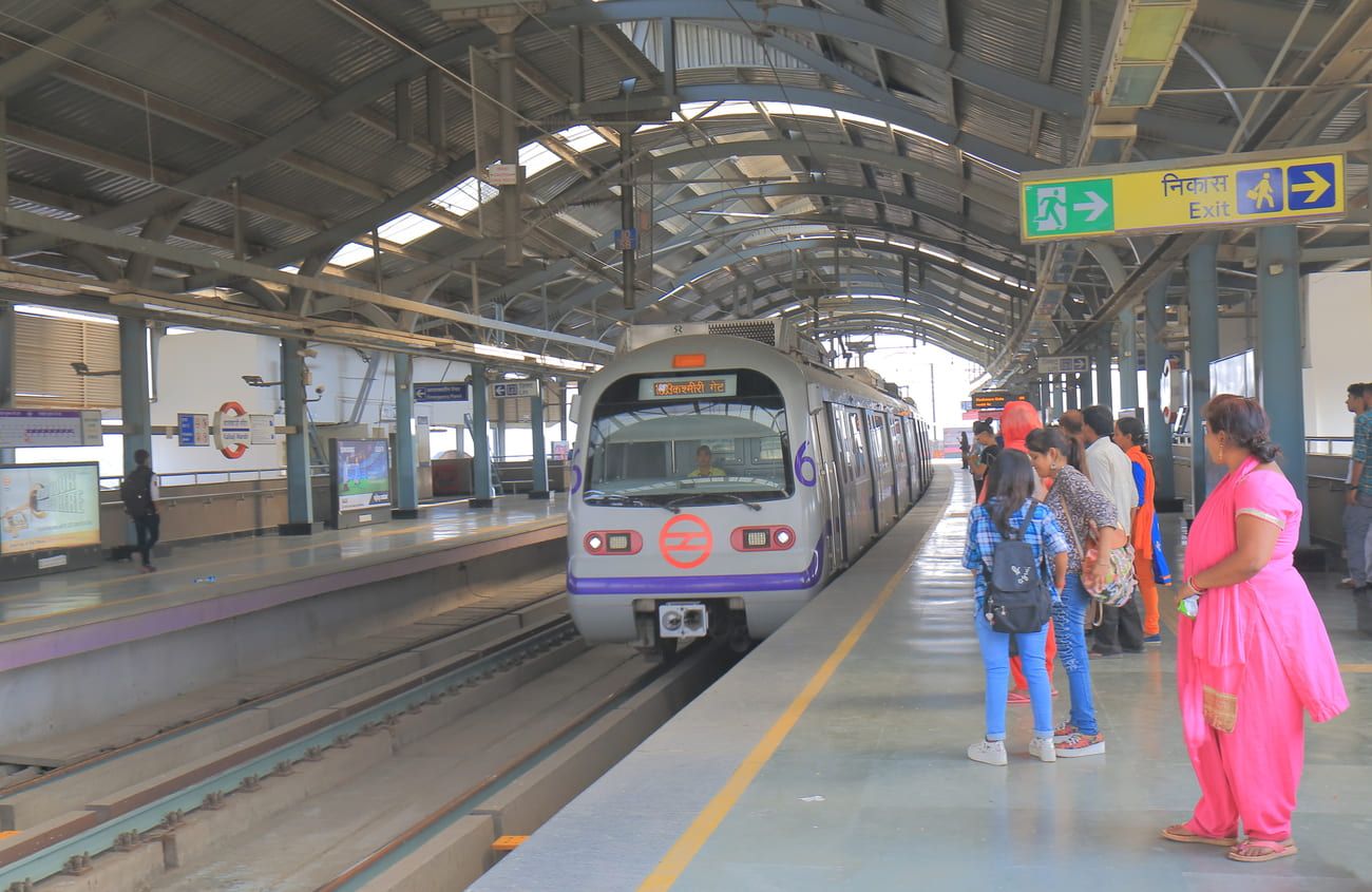 Waiting to board the subway at the Kalkaji Mandir metro station in New Delhi