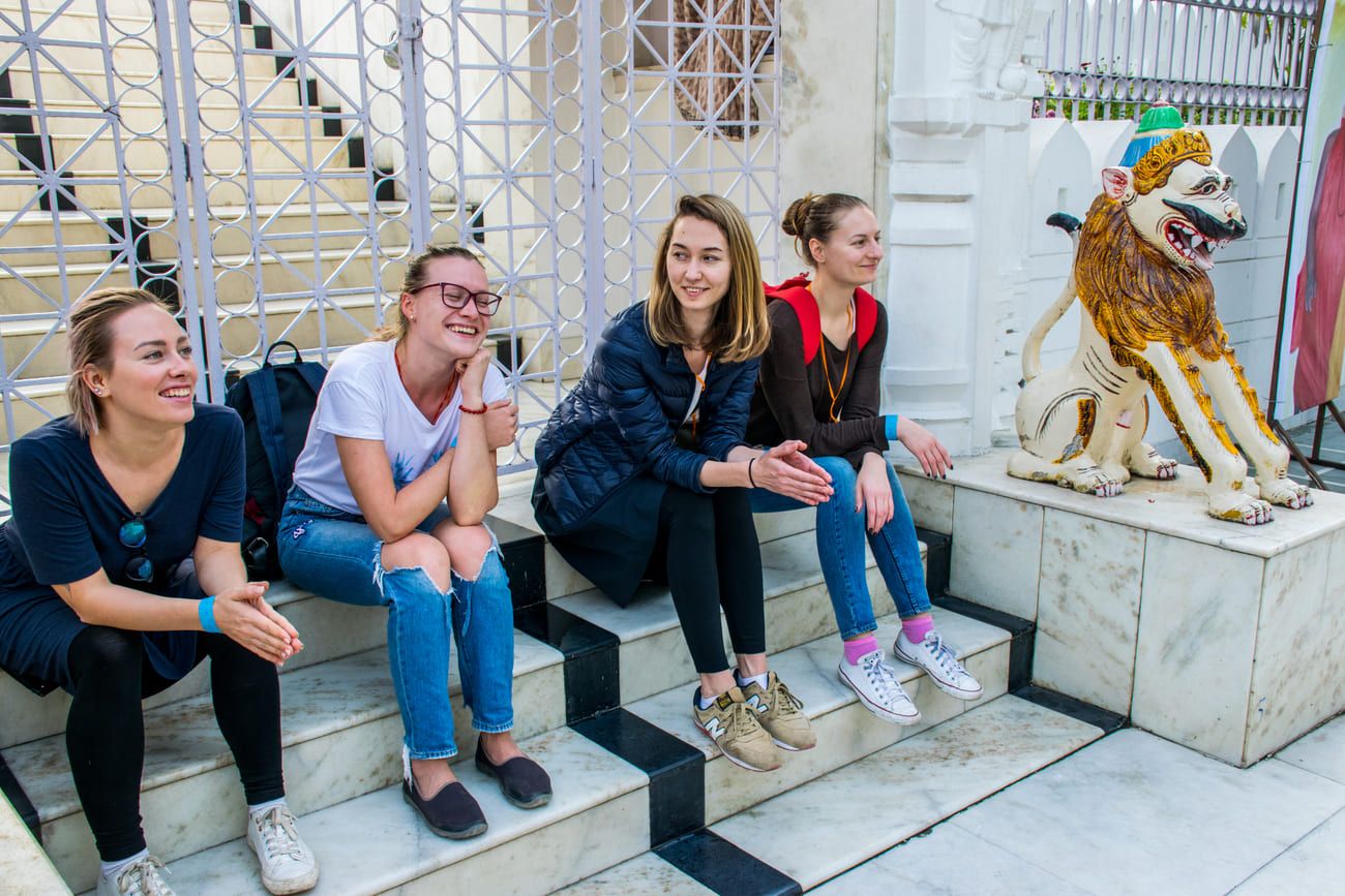 Young European tourists in front of the Jagannath temple (also known as the White Pagoda) at the Hauz Khas Complex in Delhi India