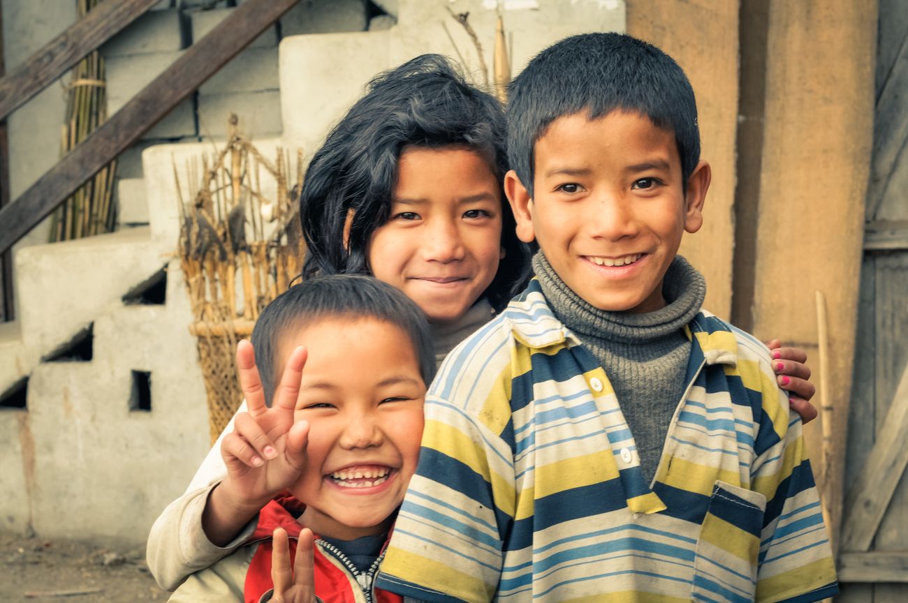 A blissful portrait of smile, innocence, and rapport shared amongst these three adorable Apatani siblings at Ziro valley, Arunachal Pradesh