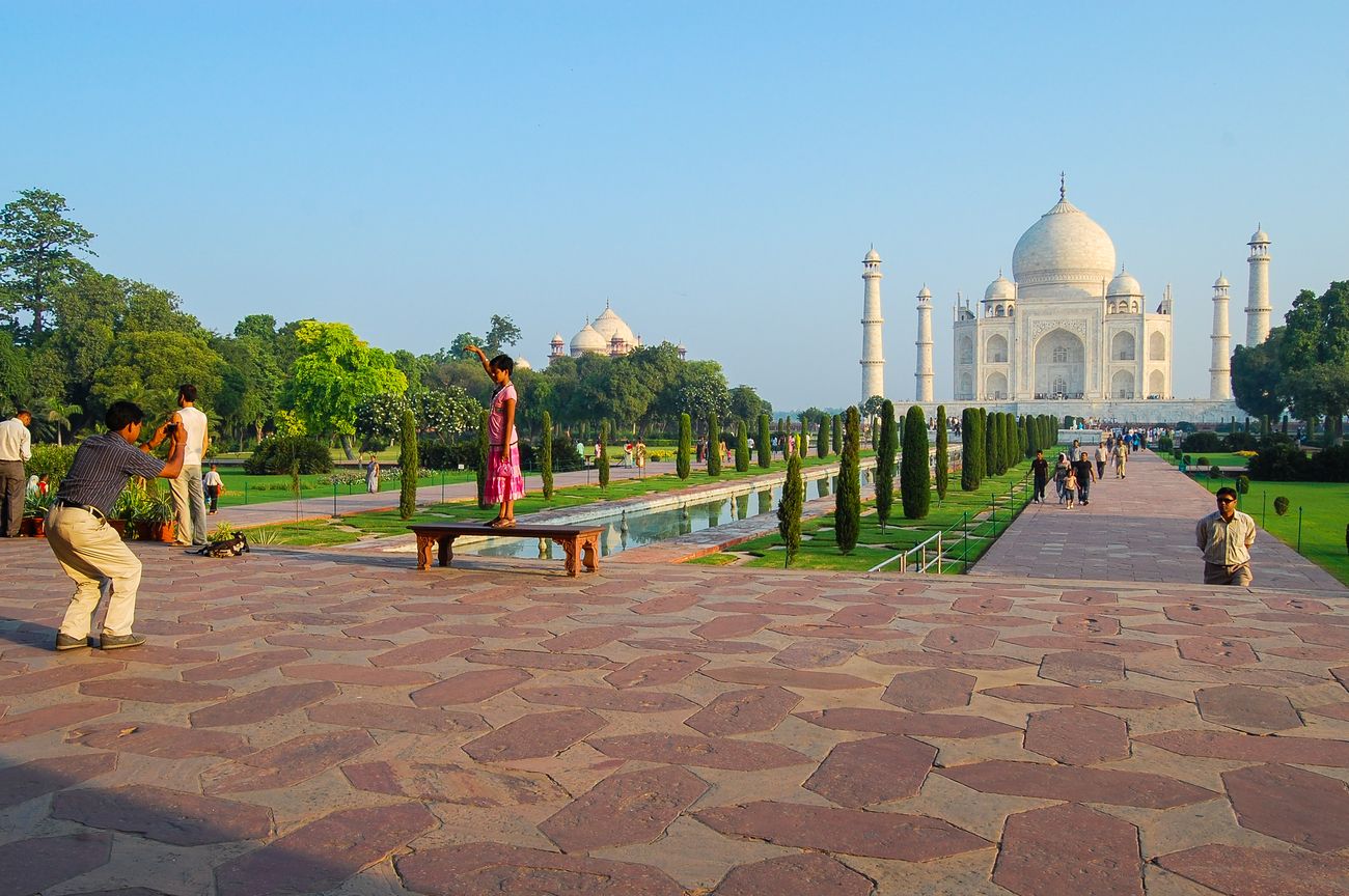 visitors taking picture in taj mahal