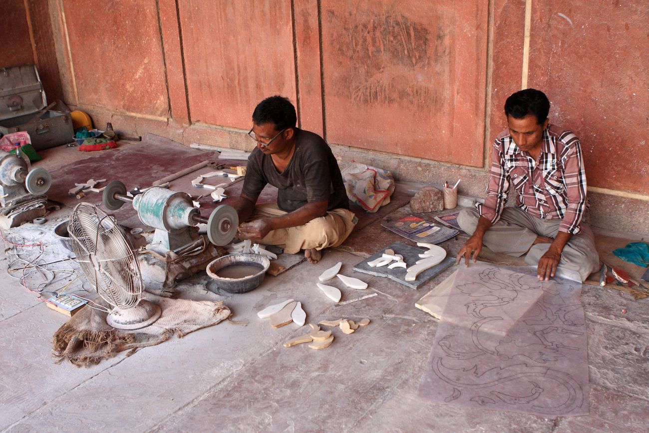 ongoing process of restoration work in taj mahal