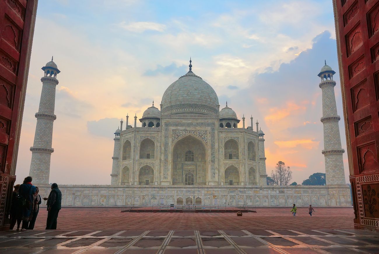 taj mahal pictured from the entrance of the mosque