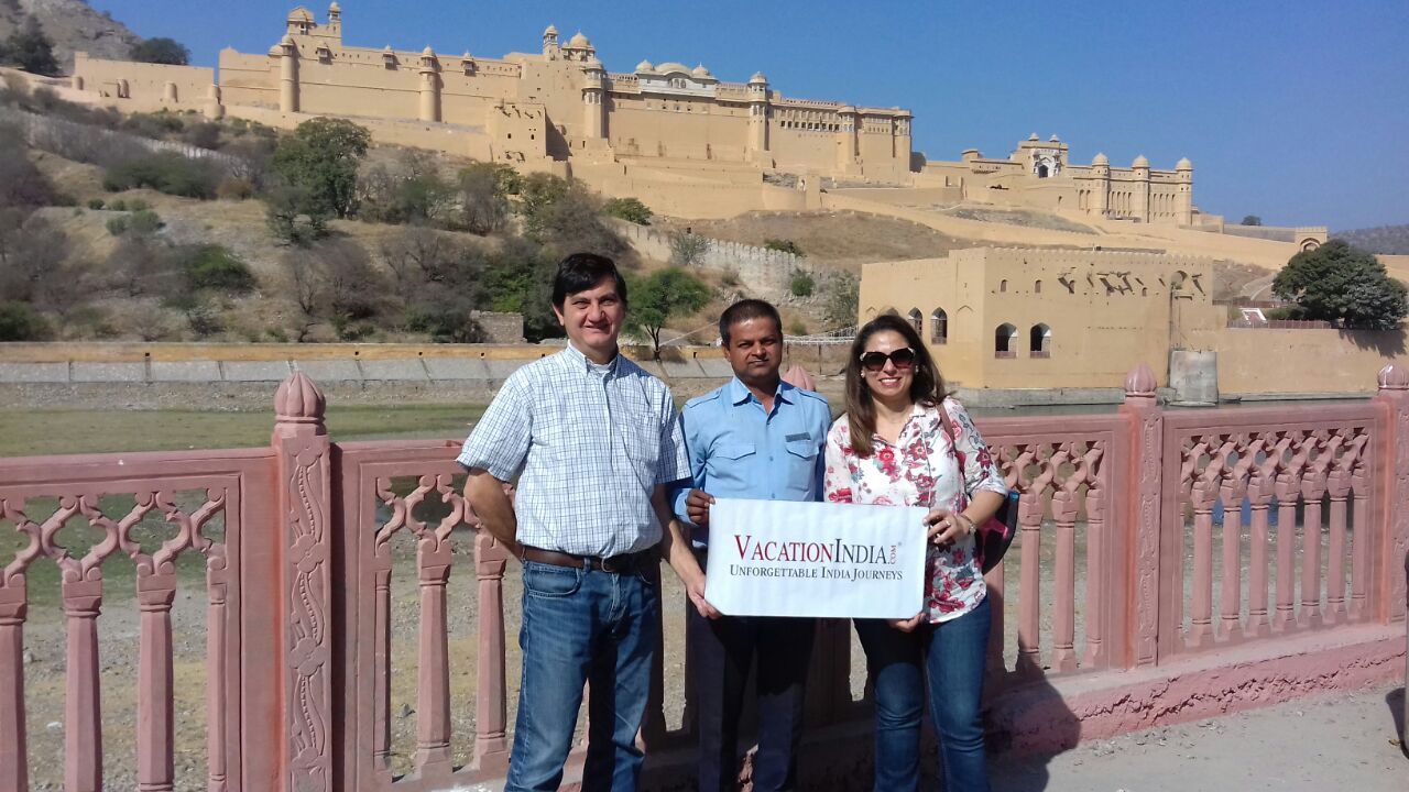 our guide madan with clients in front of amer fort in jaipur india tour