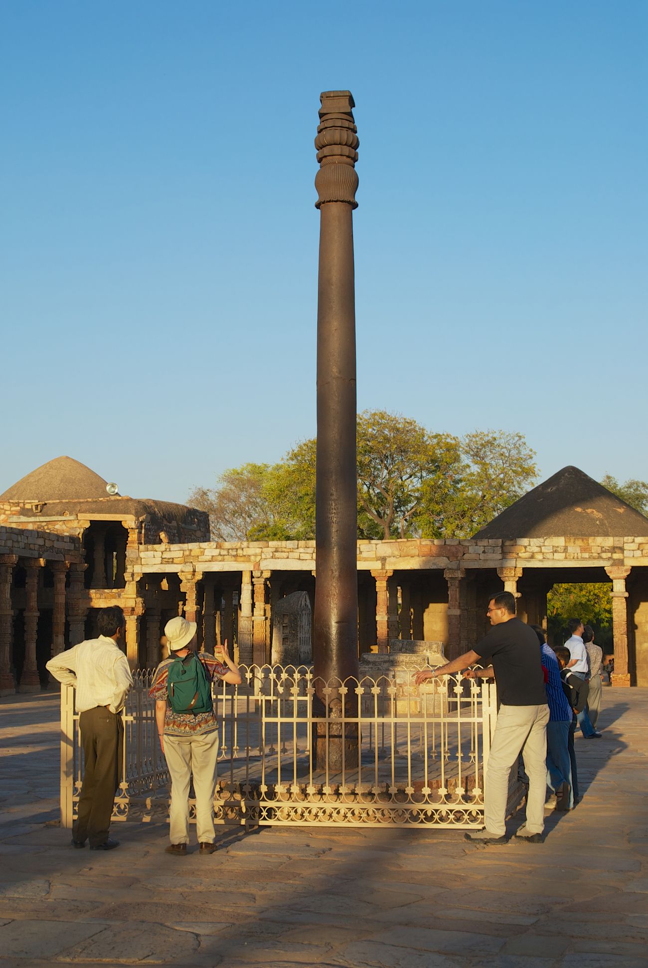 tourists visit the iron pillar at the qutb minar complex 28
