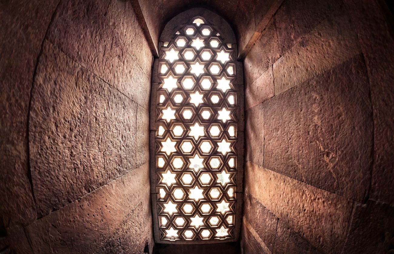 window with sunglow in qutub minar complex 21