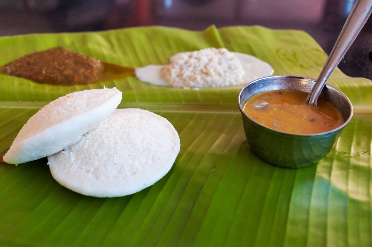 South Indian breakfast Idli is served on fresh palm leaf.