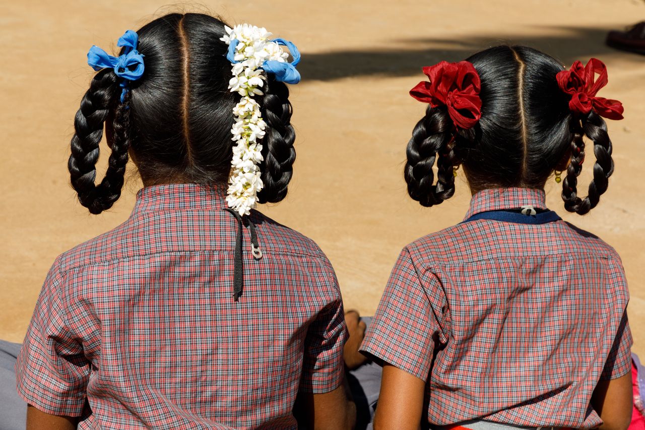 two uniformed school girls nature walk kabini