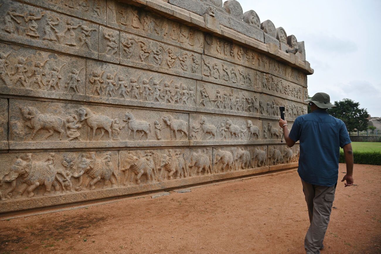 the ancients carvings on a wall in Hampi