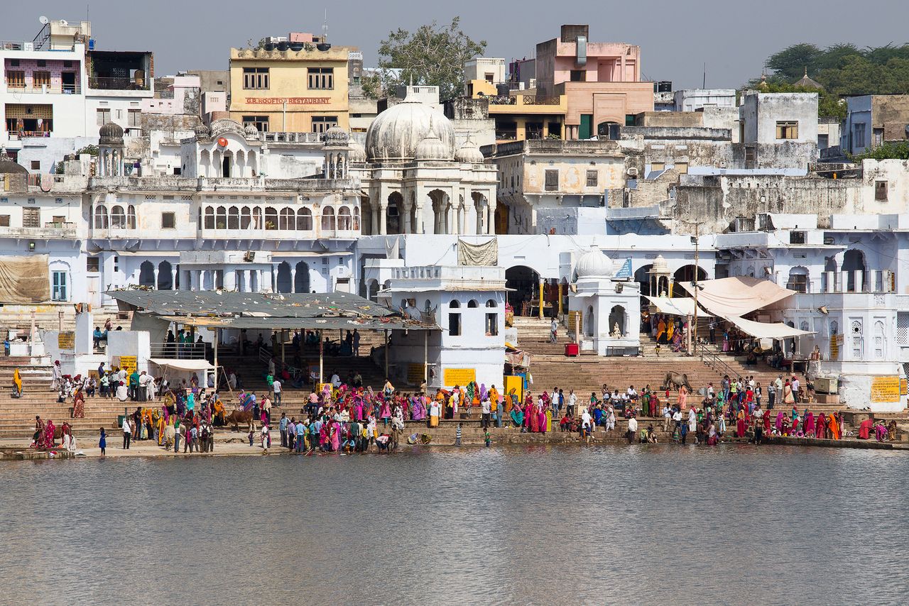 people perform puja pushkar holy lake