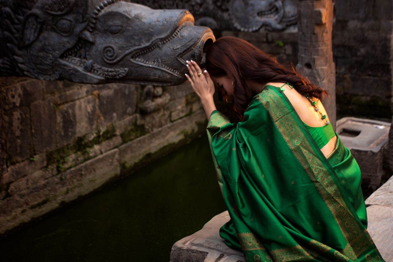 young woman performing a religious ritual in Kathmandu