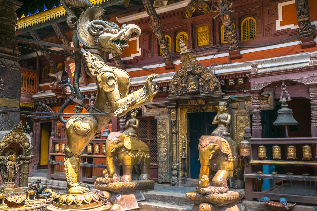 golden decoration figures in temple in patan kathmandu