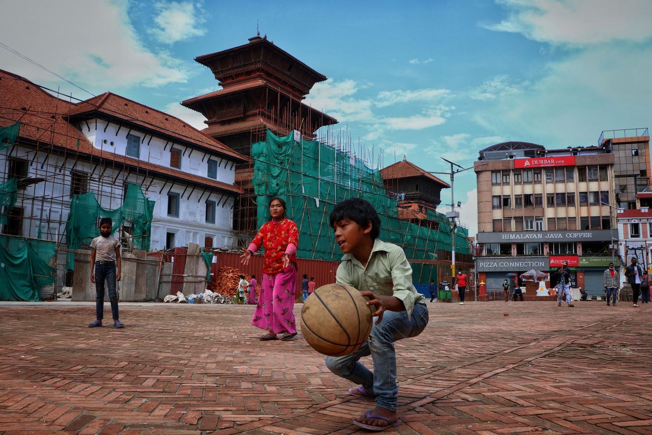 Childrens playing volleyball in front of Basantapur Durbar square kathmandu