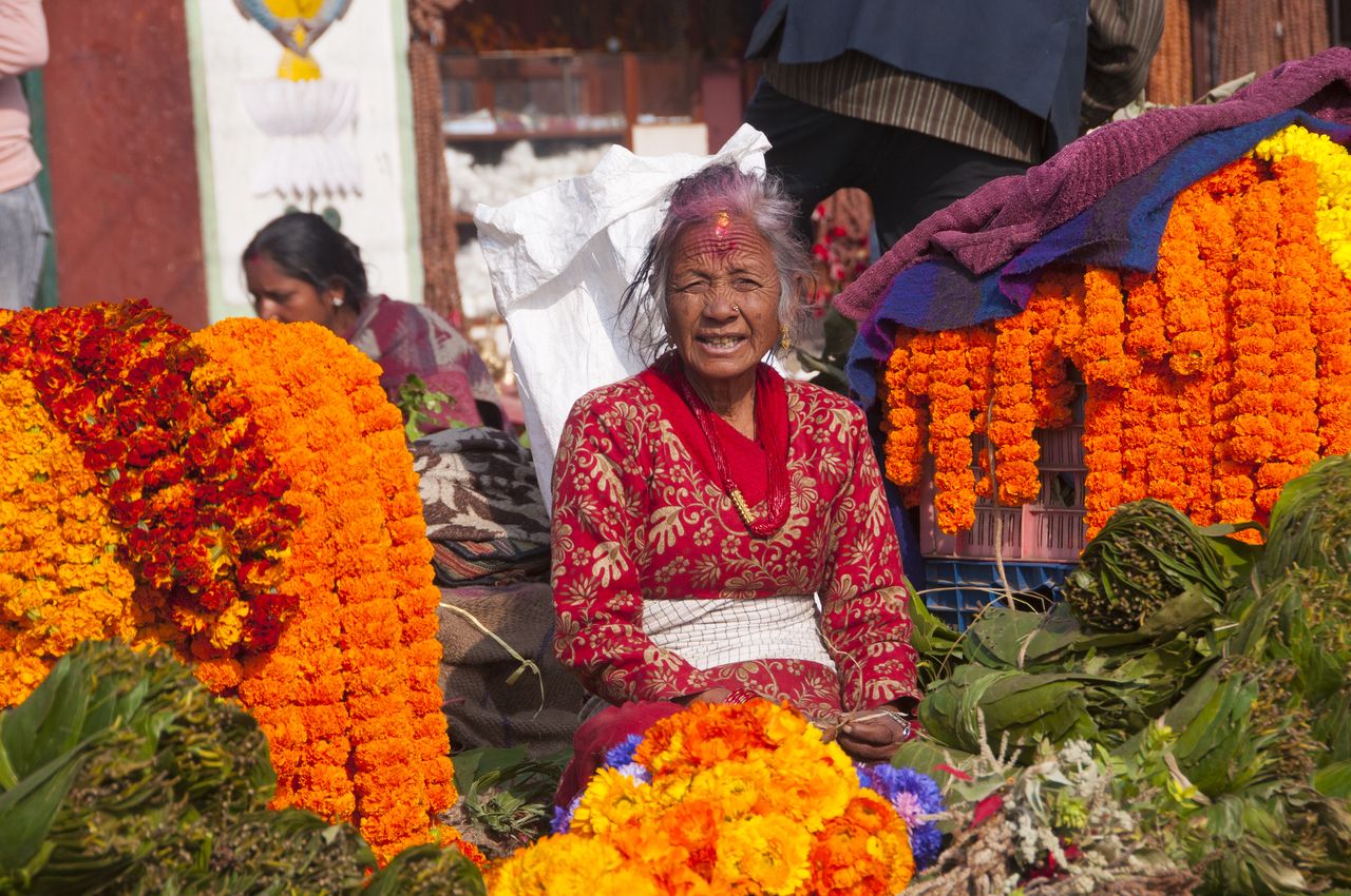 Women vendor selling marigold necklaces Pashupatinath Temple