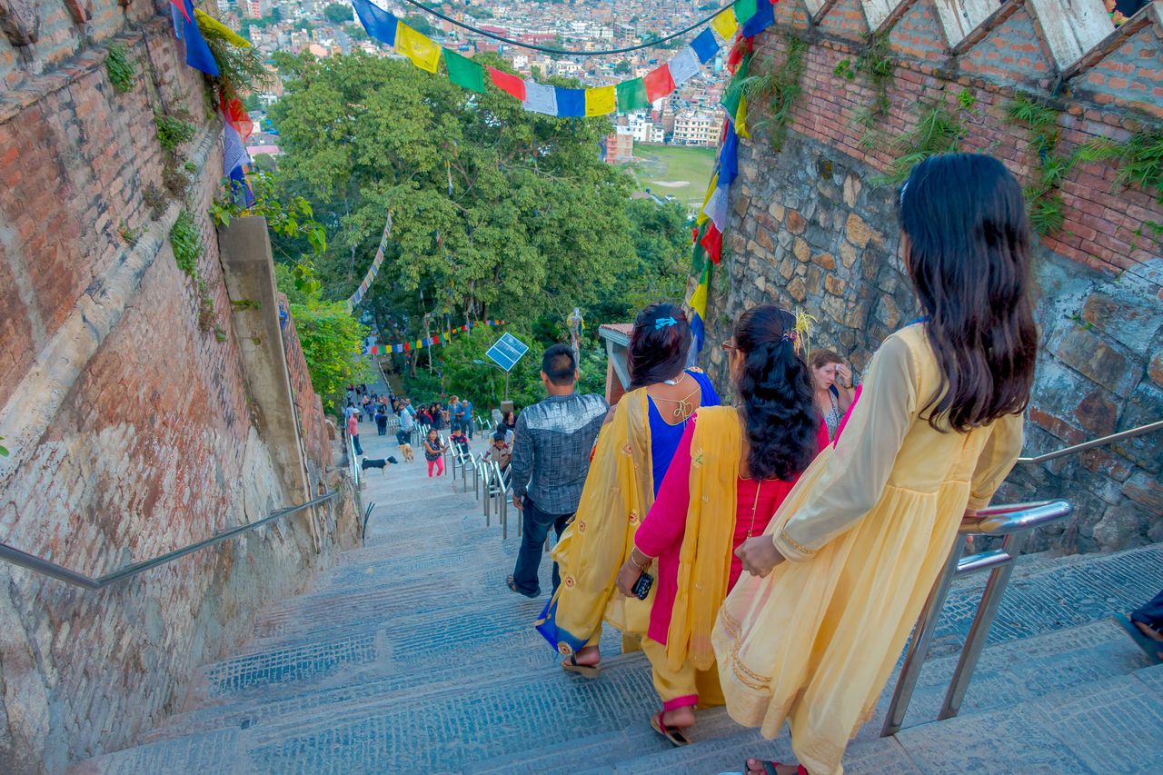 people walking dowstairs to Swayambhunath kathmandu