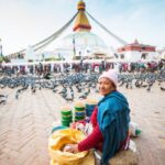 Women walk around the stupa kathmandu