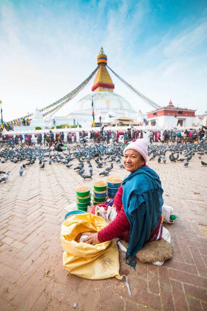 Women walk around the stupa kathmandu